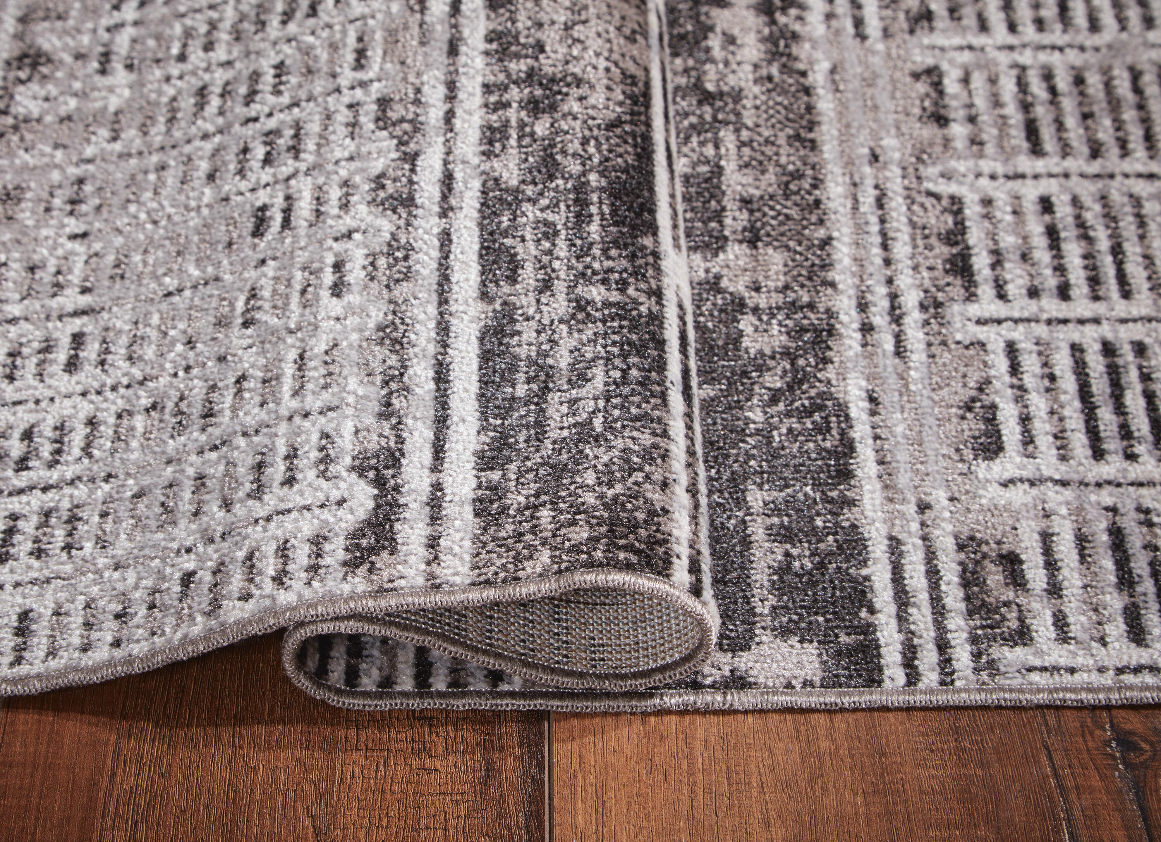 Henchester Washable 5' x 7' Rug | Ashley